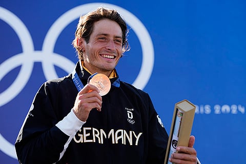 Men's slalom kayak cross medal ceremony: Bronze medalist Noah Hegge of Germany